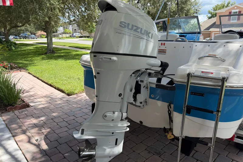 Slide: The Image of 2021 Campion Allante 180 boat with Suzuki outboard motor on a sunny driveway. - 8