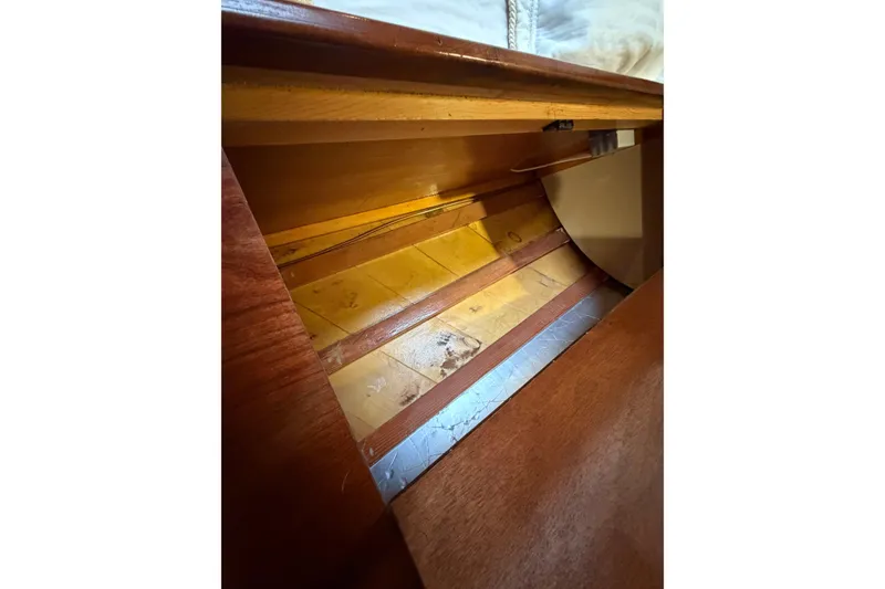 Slide: The Image of Interior view of a 2011 Custom Build 50' Ketch, showcasing wooden craftsmanship. - 58