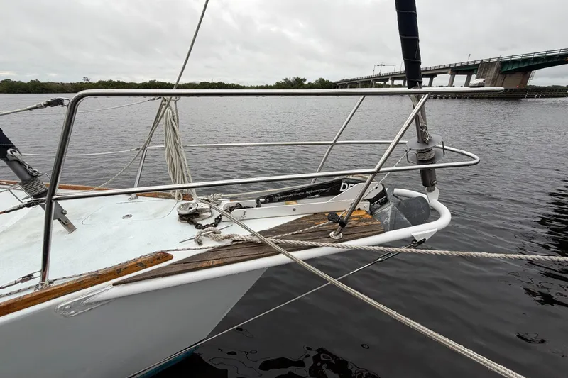Slide: The Image of Custom Build 50' Ketch, 2011, docked near a bridge on a cloudy day. - 14
