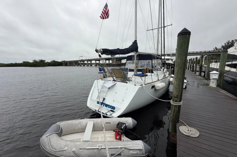 Slide: The Image of Custom Build 50' Ketch, 2011, docked with dinghy, overcast sky, pilothouse design. - 4