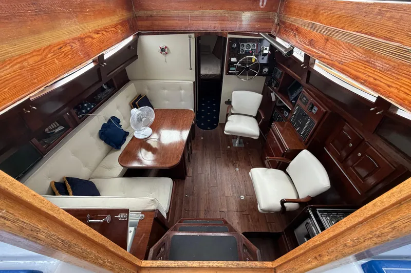 Slide: The Image of Interior of 2011 Custom Build 50' Ketch, featuring elegant wood and leather seating. - 26
