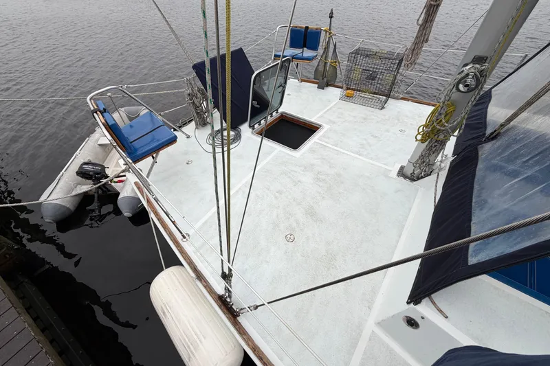 Slide: The Image of Deck view of a 2011 Custom Build 50' Ketch, featuring seating and rigging. - 7