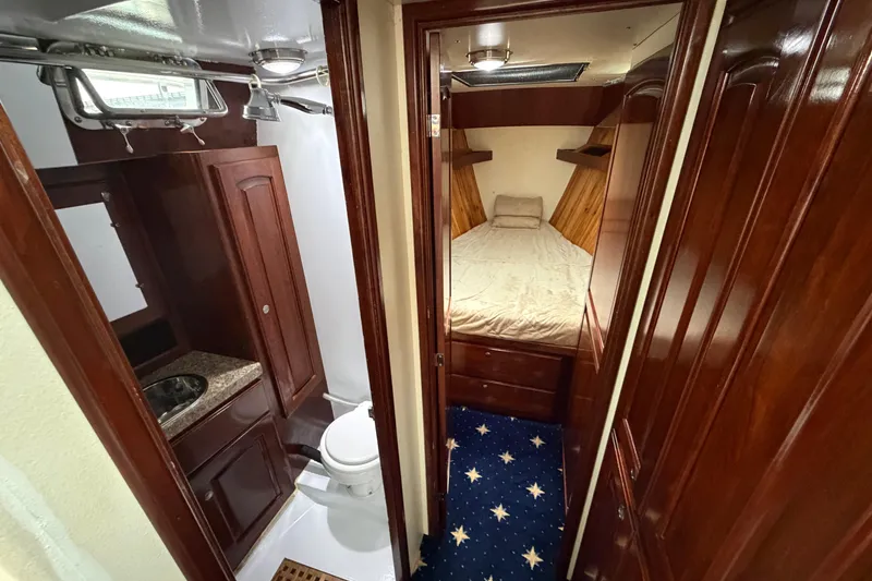Slide: The Image of Luxurious 2011 Custom Build 50' Ketch interior with wood finish, bedroom, and bathroom. - 42