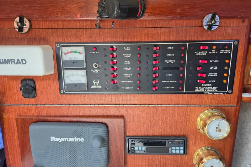 Slide: The Image of Electrical control panel on a 1989 Ericson Olsen 34 sailboat with navigation equipment. - 10
