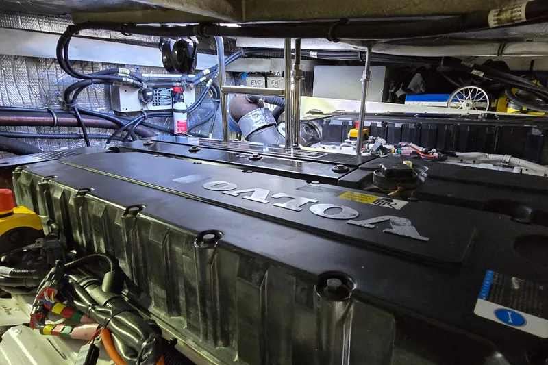 Slide: The Image of Engine room of a 2006 Cruisers Yachts 520 Express, featuring a Volvo engine. - 88