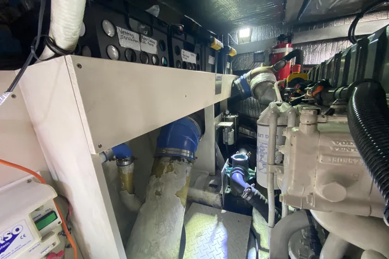 Slide: The Image of Engine room of 2006 Cruisers Yachts 520 Express with visible machinery and components. - 99