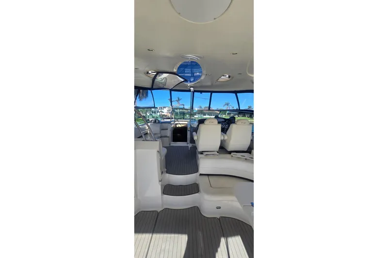 Slide: The Image of Interior view of 2006 Cruisers Yachts 520 Express, featuring spacious seating and helm area. - 31