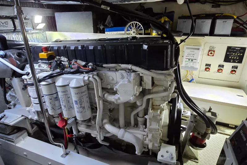 Slide: The Image of Engine room of 2006 Cruisers Yachts 520 Express, showcasing detailed machinery and components. - 89
