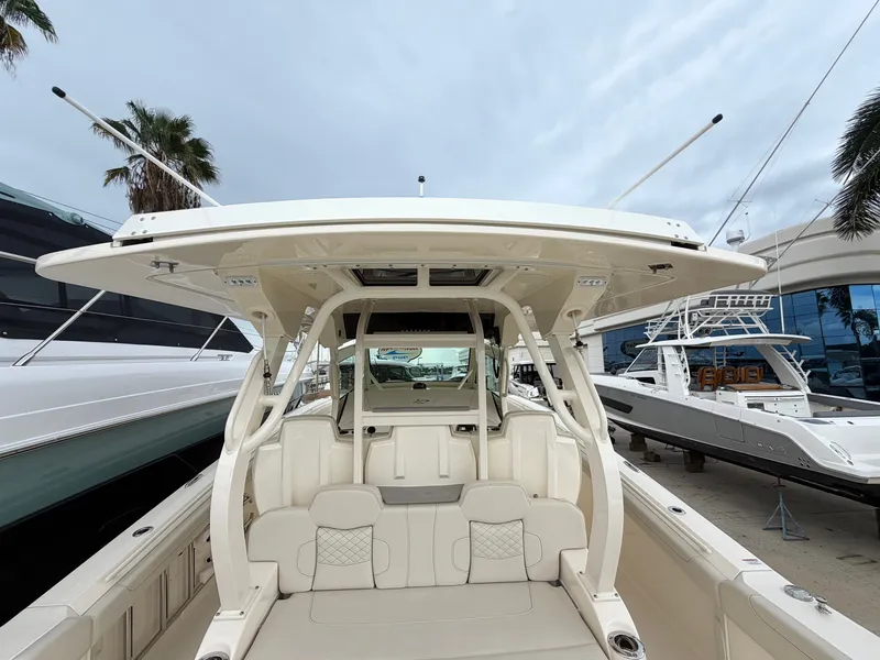 Slide: The Image of The image shows a 2025 Scout 400 LXF boat with a spacious cockpit and modern seating. - 22