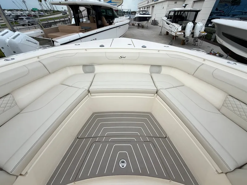 Slide: The Image of The image shows the bow area of a 2025 Scout 400 LXF boat with luxurious seating. - 40