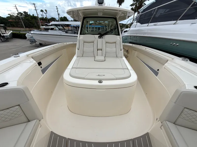 Slide: The Image of The image shows the cockpit of a 2025 Scout 400 LXF boat with luxurious seating. - 42