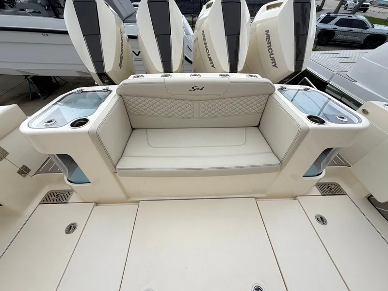 Slide: The Image of The 2025 Scout 400 LXF features a luxurious bench seat with integrated cup holders and storage. - 16