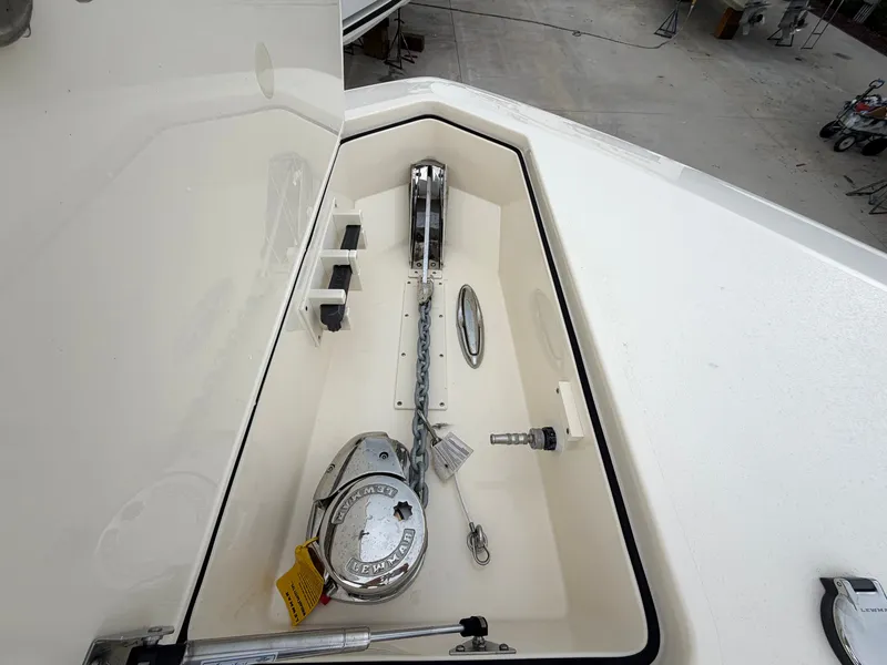 Slide: The Image of The anchor locker of a 2025 Scout 400 LXF features a windlass and chain guide. - 41