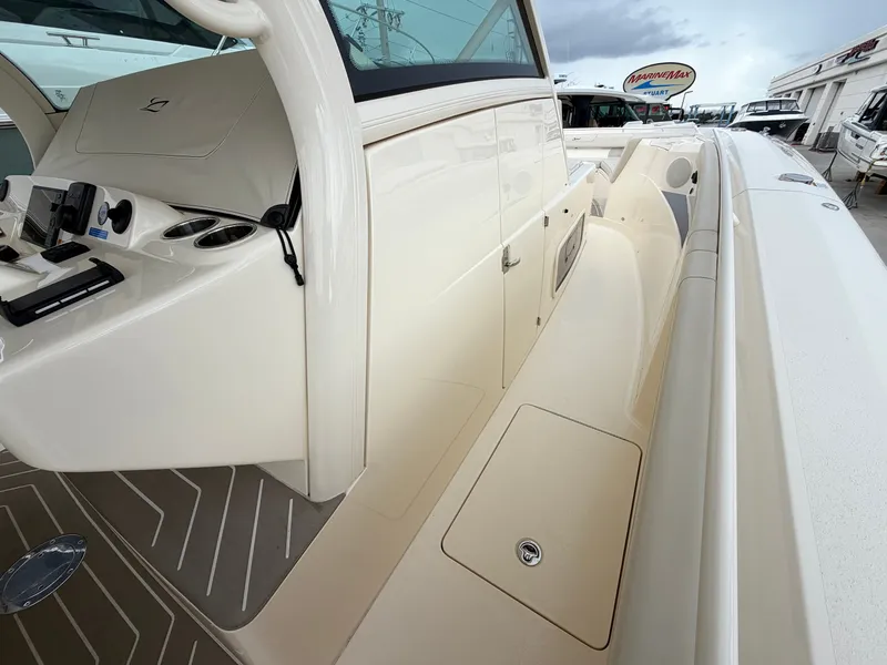 Slide: The Image of Scout 400 LXF 2025 with sleek, cream-colored finish and modern features. - 37