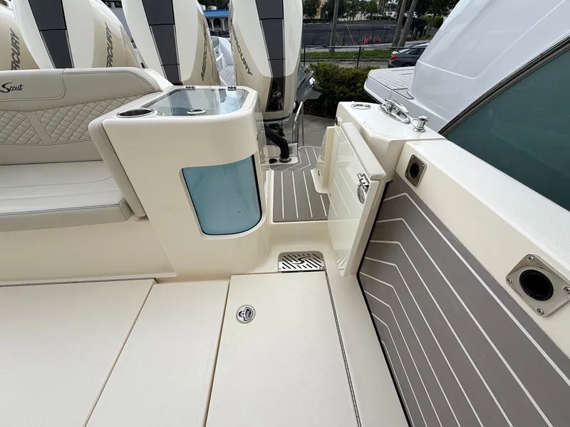 Slide: The Image of The image shows the deck of a 2025 Scout 400 LXF boat with sleek seating and modern details. - 19