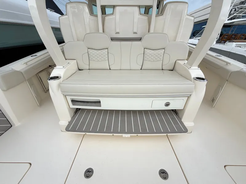Slide: The Image of The 2025 Scout 400 LXF features a luxurious bench seat with storage and elegant detailing. - 24