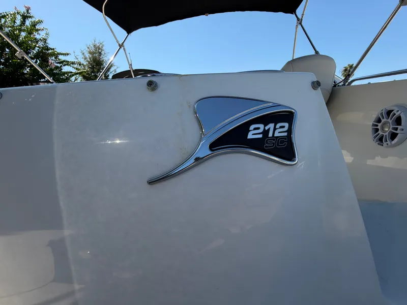 Slide: The Image of Close-up of a 2024 Stingray 212 SC boat logo with black and silver design. - 5
