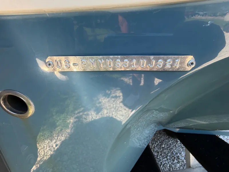 Slide: The Image of Close-up of the hull identification number on a 2024 Stingray 212 SC boat. - 4