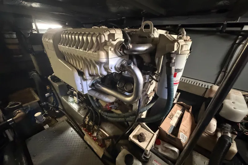 Slide: The Image of Engine room of 2002 Sea Ray 480 Motor Yacht, showcasing detailed machinery components. - 36