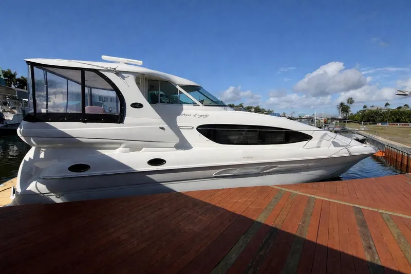 The Image of 2002 Sea Ray 480 Motor Yacht docked under clear blue sky. - 0