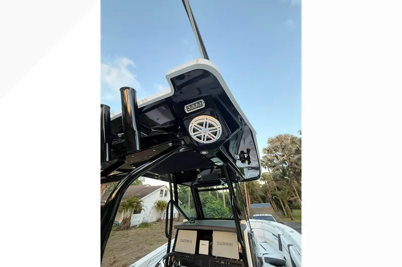 Slide: The Image of 2021 Blackfin 272 CC boat with Garmin electronics and sleek black canopy. - 14