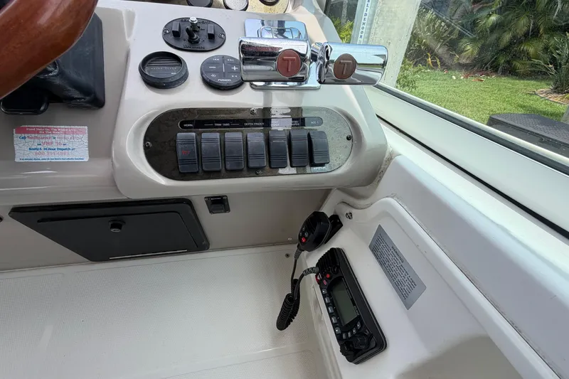 Slide: The Image of 2001 Cruisers Yachts 3672 Express helm with controls and communication equipment. - 16