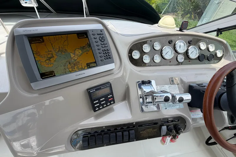 Slide: The Image of Control panel of a 2001 Cruisers Yachts 3672 Express with Garmin GPS and gauges. - 12