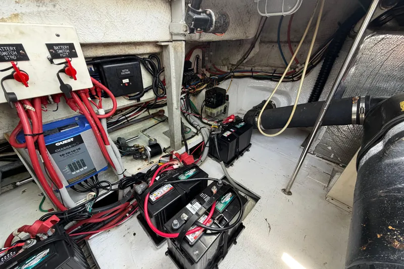 Slide: The Image of Engine room of 2001 Cruisers Yachts 3672 Express with batteries and wiring. - 45