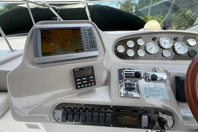 Slide: The Image of Dashboard of 2001 Cruisers Yachts 3672 Express with Garmin GPS and control panel. - 13