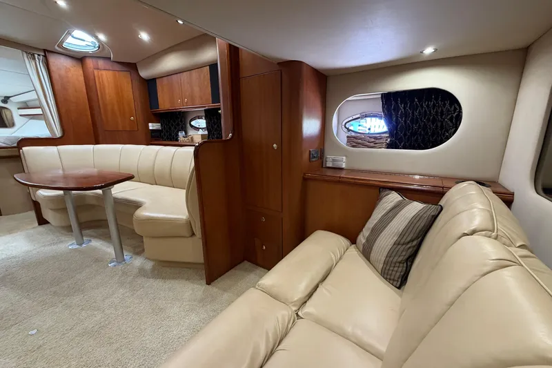 Slide: The Image of Luxurious interior of 2001 Cruisers Yachts 3672 Express with plush seating and elegant wood finishes. - 31