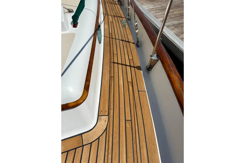 Slide: The Image of 1977 Hans Christian Ketch deck with teak wood finish and polished railings. - 12