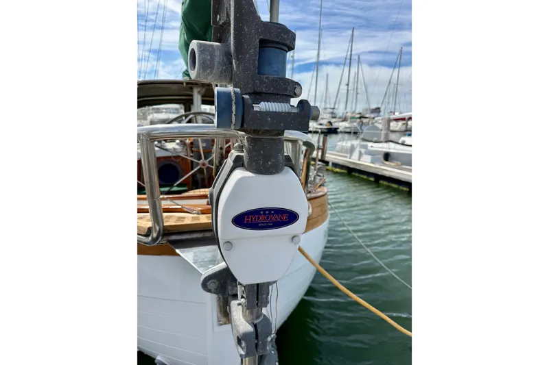 Slide: The Image of 1977 Hans Christian Ketch with Hydrovane steering system at marina. - 64