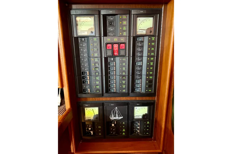 Slide: The Image of Electrical panel of a 1977 Hans Christian Ketch sailboat with gauges and switches. - 51