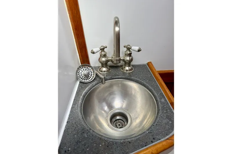 Slide: The Image of Stainless steel sink with vintage faucet on 1977 Hans Christian Ketch boat. - 49