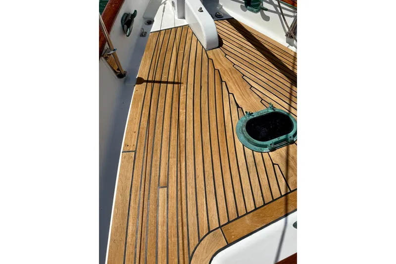Slide: The Image of Teak deck of 1977 Hans Christian Ketch sailboat with green hatch. - 11