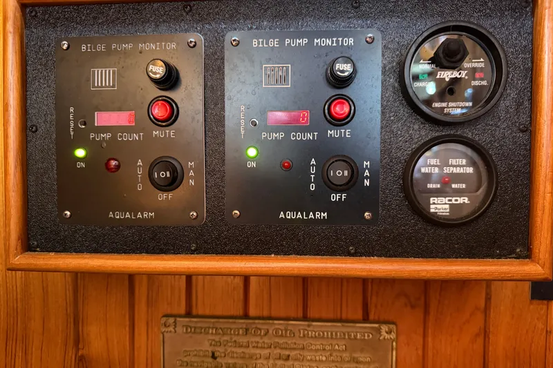 Slide: The Image of Control panel of a 1977 Hans Christian Ketch with bilge pump monitors and gauges. - 65
