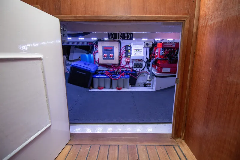Slide: The Image of Electrical room of the 2006 Custom Carolina 36 Express with batteries and controls. - 46