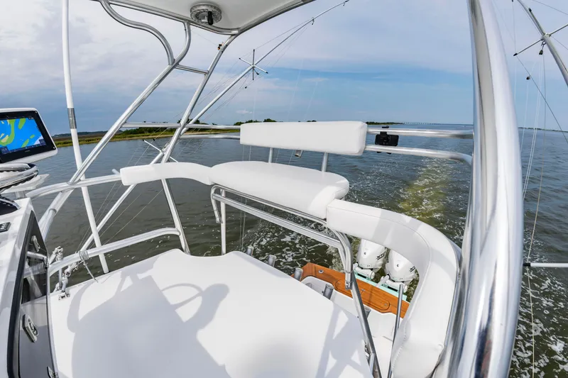 Slide: The Image of The image shows the cockpit of a 2006 Custom Carolina 36 Express on the water. - 28