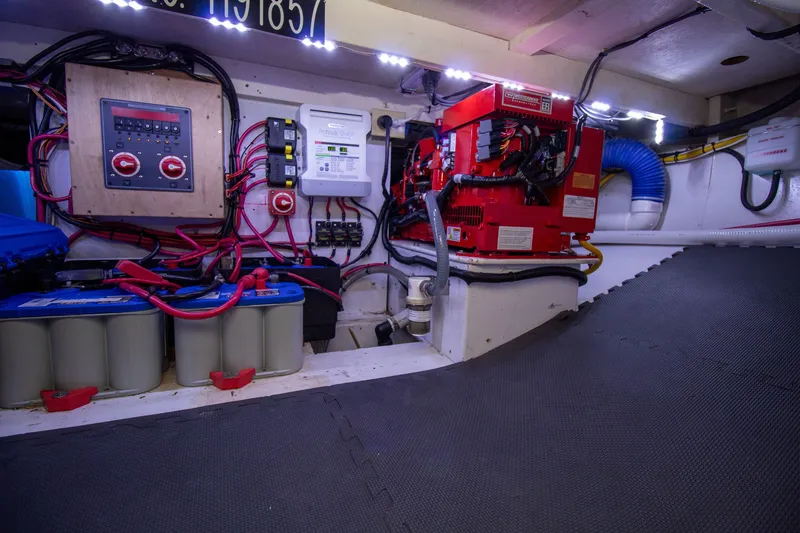 Slide: The Image of Electrical and battery system in the engine room of a 2006 Custom Carolina 36 Express. - 47