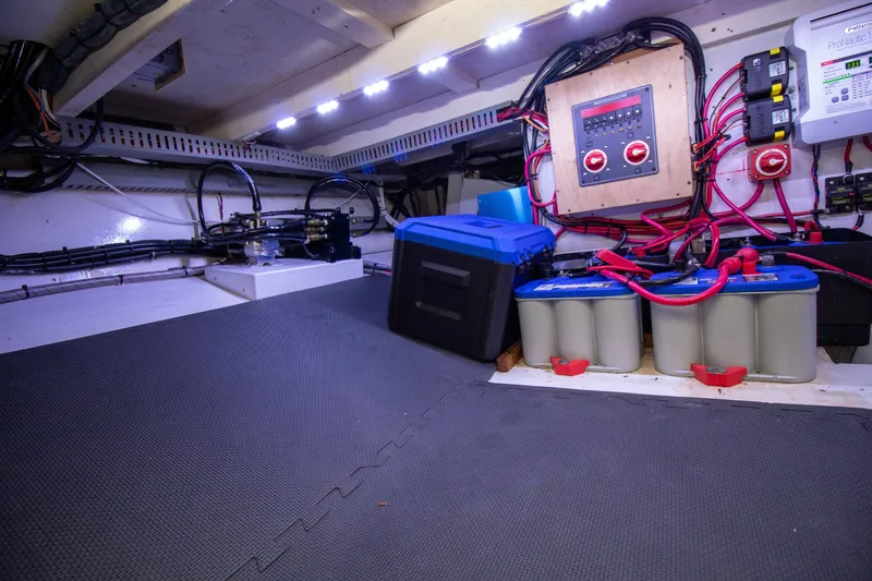Slide: The Image of Electrical and battery system in the engine room of a 2006 Custom Carolina 36 Express. - 48