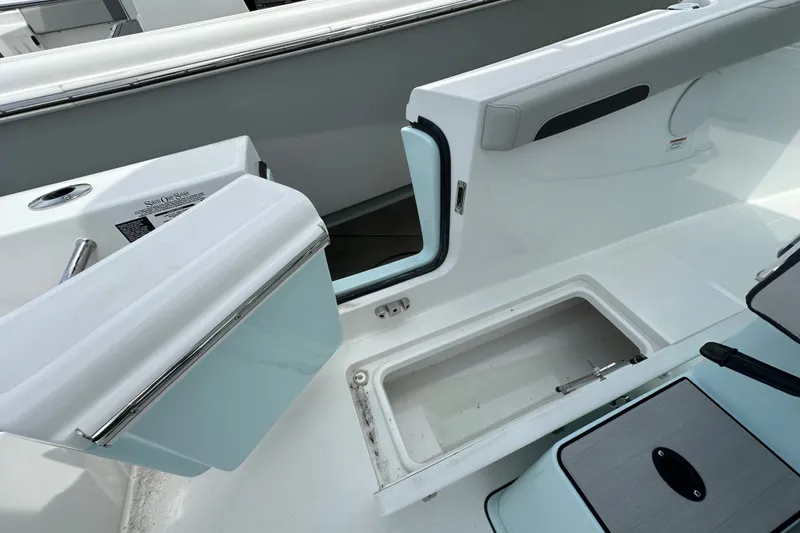 Slide: The Image of 2027 Sea Pro 265FLX Sandbar boat interior with storage compartments and seating. - 13