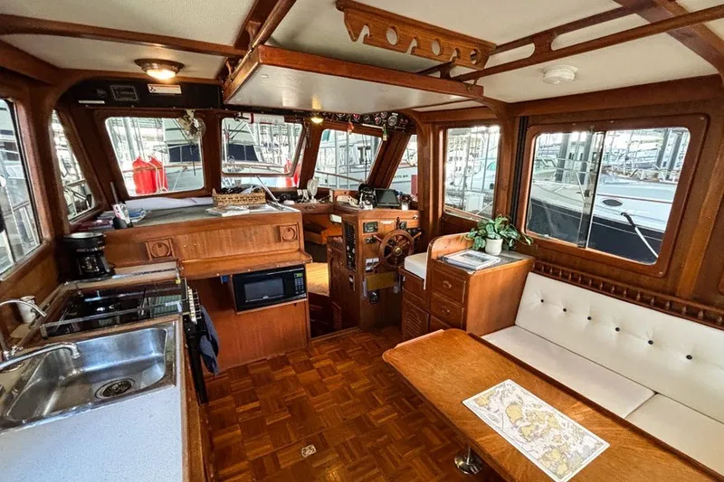 Slide: The Image of Interior of a 1979 Hershine San Francisco boat with wood finish and modern amenities. - 6
