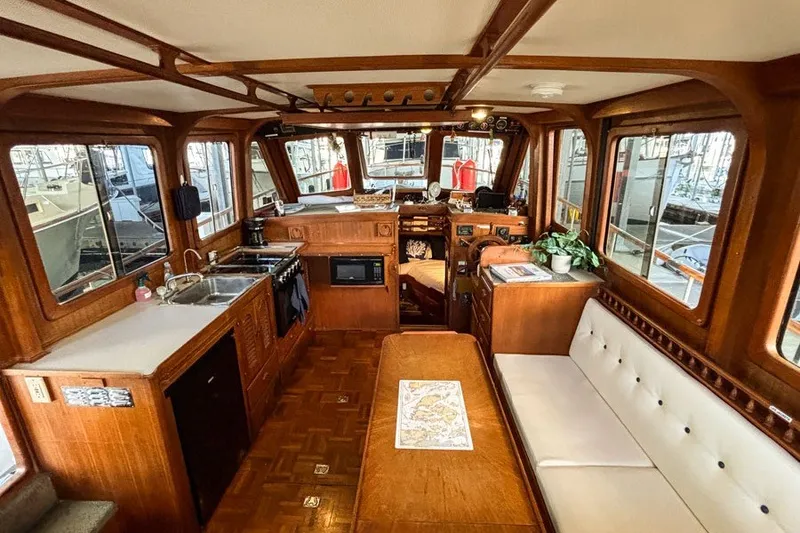 Slide: The Image of Interior of a 1979 Hershine San Francisco boat with wood finish and seating area. - 5