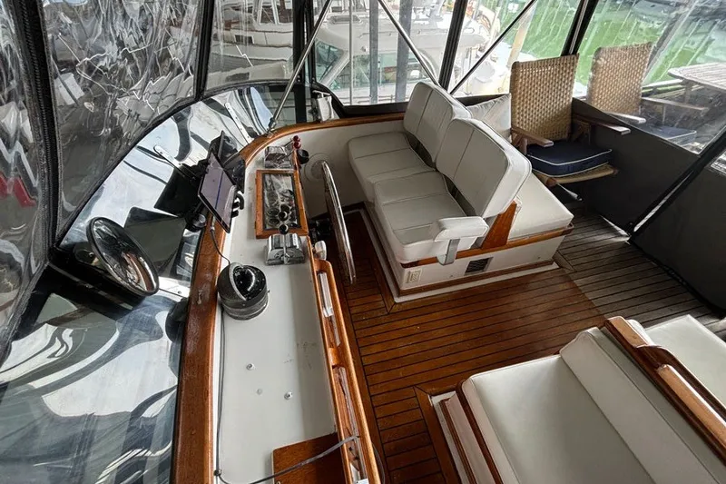 Slide: The Image of 1979 Hershine San Francisco boat interior with wooden flooring and cushioned seating. - 16