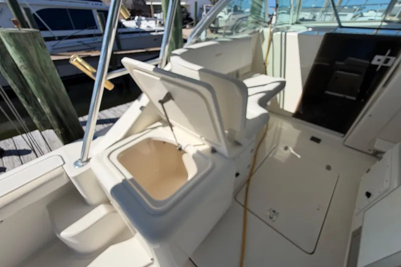 Slide: The Image of 2001 Pursuit 3000 Express boat interior with open storage compartment. - 19