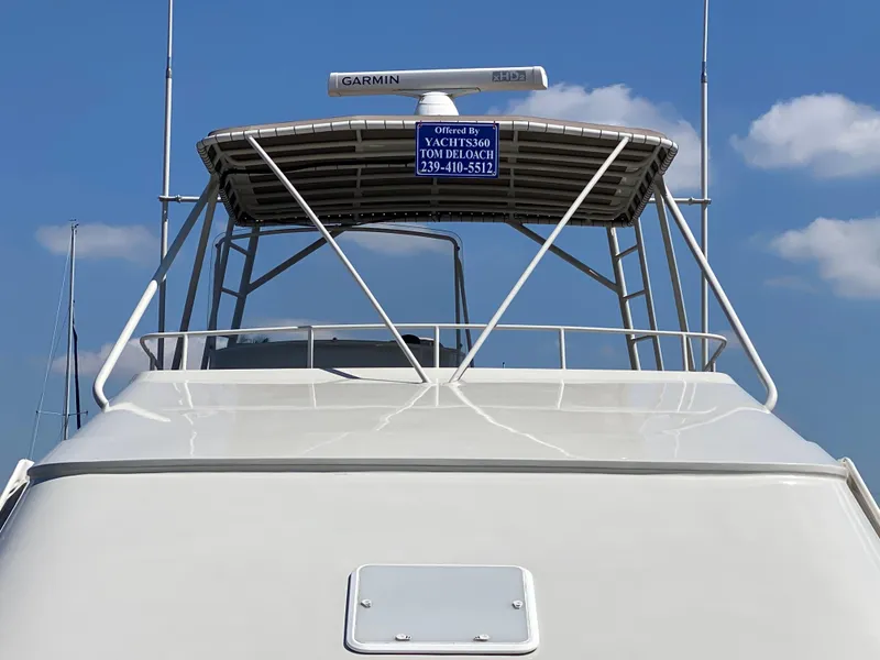 Slide: The Image of 1995 Mares 58 Power Catamaran with Garmin radar, clear sky background. - 30