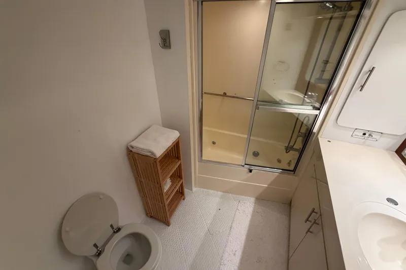 Slide: The Image of Bathroom interior of 1991 Hatteras 70 Motor Yacht with shower and toilet. - 107