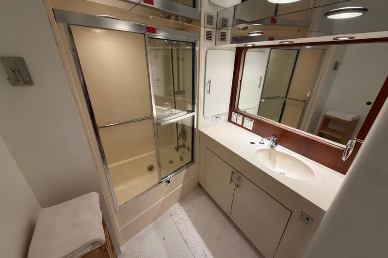 Slide: The Image of Bathroom interior of 1991 Hatteras 70 Motor Yacht with shower and vanity. - 106