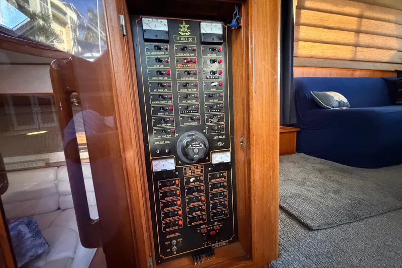 Slide: The Image of Electrical panel inside 1987 Hi-Star 55 Yacht Fisherman, featuring various switches and gauges. - 31