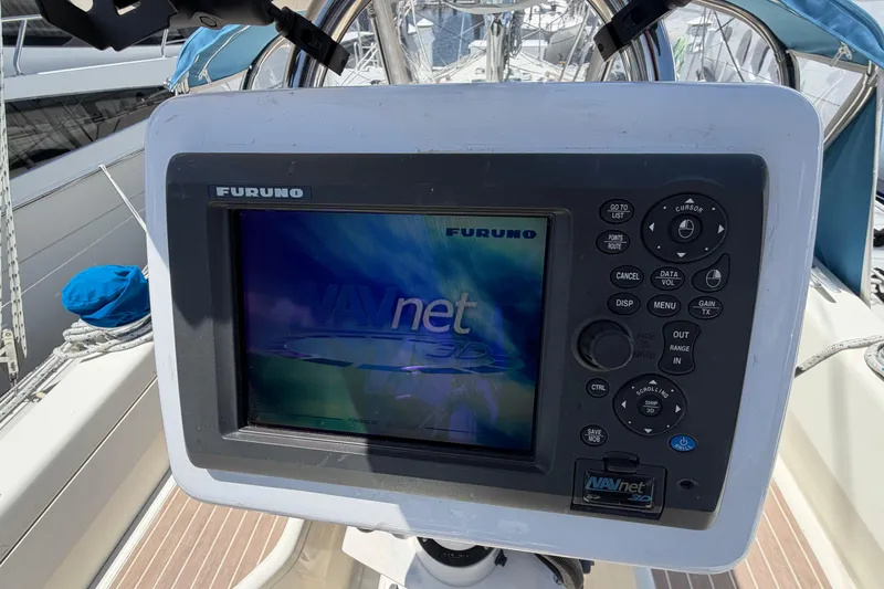 Slide: The Image of Furuno NAVnet display on 1987 Moody 376 sailboat, showing navigation controls and screen. - 19